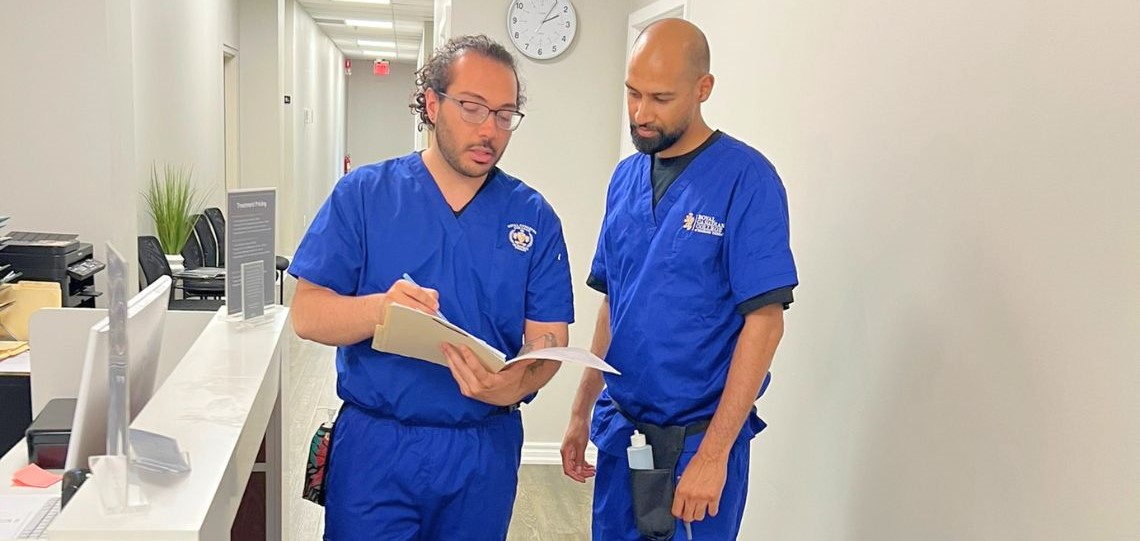 RCC massage therapy students reviewing clinical training materials
